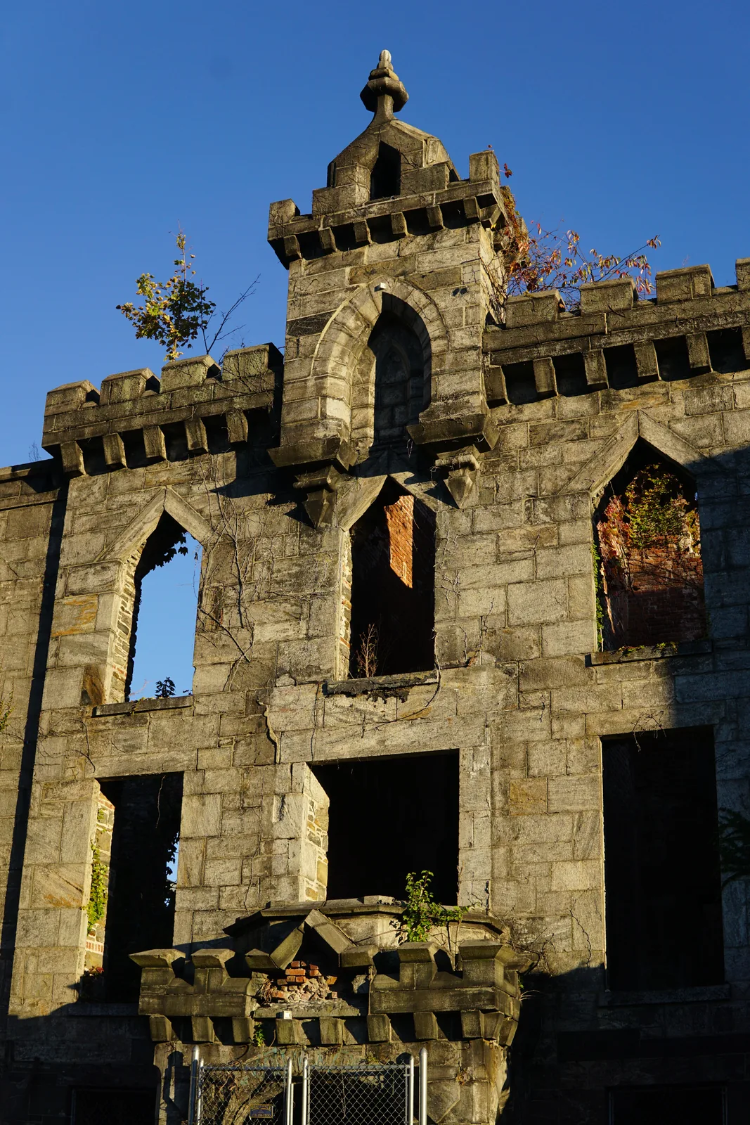 The ruined gothic facade of the Roosevelt Island smallpox hospital against a blue sky